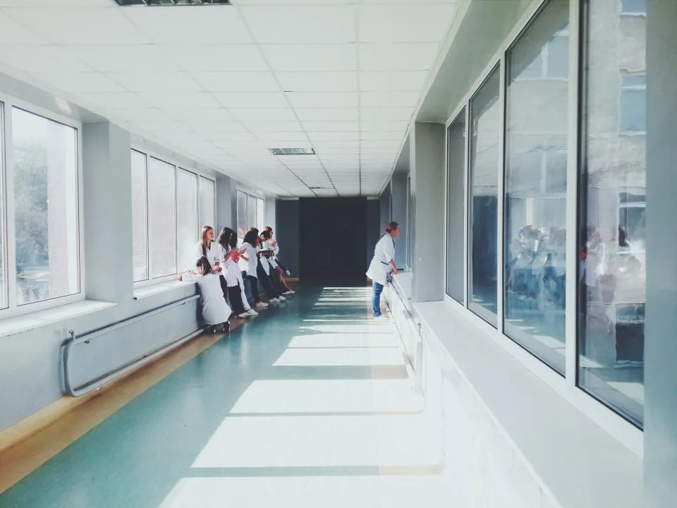 A quiet, brightly lit hospital corridor
